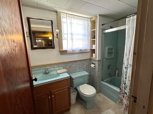 full bathroom featuring shower / bath combination with curtain, tile flooring, vanity, and toilet
