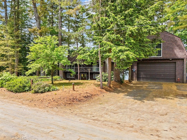 obstructed view of property featuring a garage