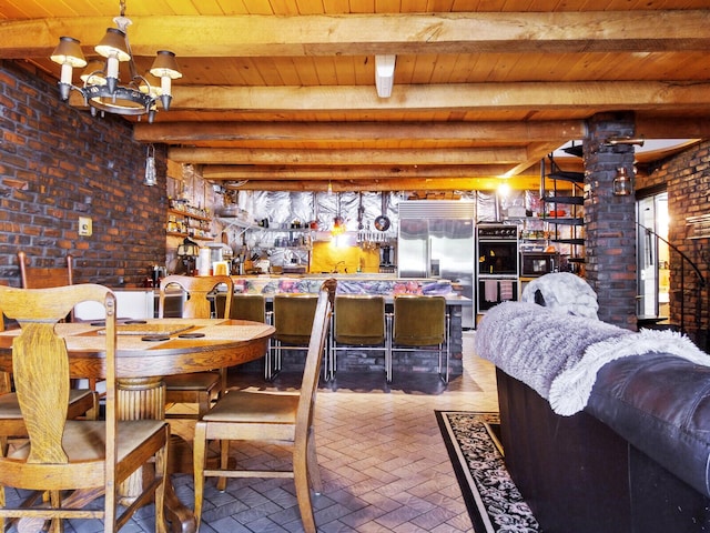 interior space featuring wooden ceiling, brick wall, an inviting chandelier, and beamed ceiling