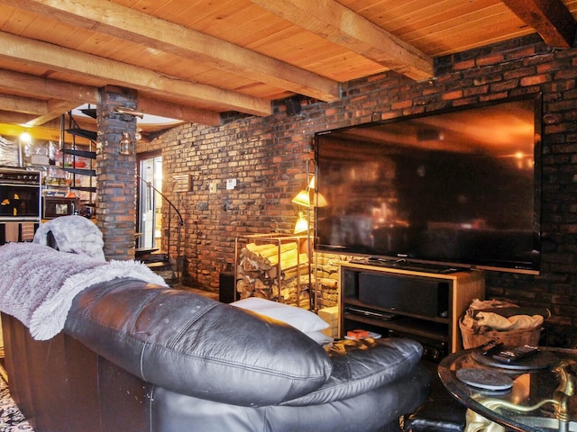 living room with wooden ceiling, brick wall, ornate columns, and beamed ceiling