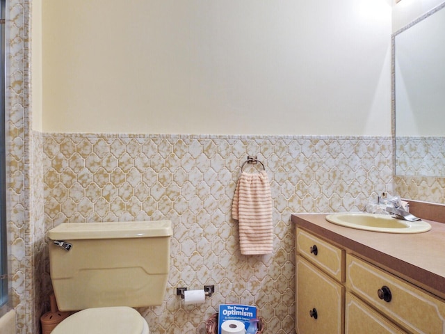 bathroom with toilet and vanity