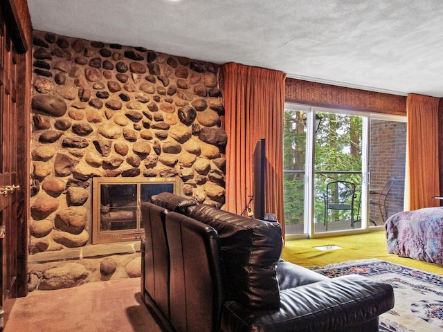 living room featuring carpet and a fireplace