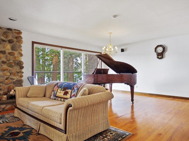 living room with wood-type flooring and a notable chandelier