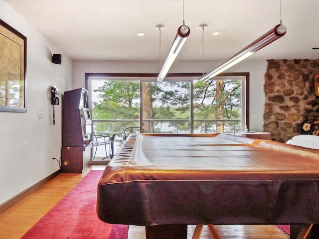 recreation room with pool table and light hardwood / wood-style floors