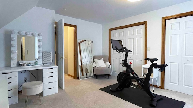 workout area featuring light colored carpet