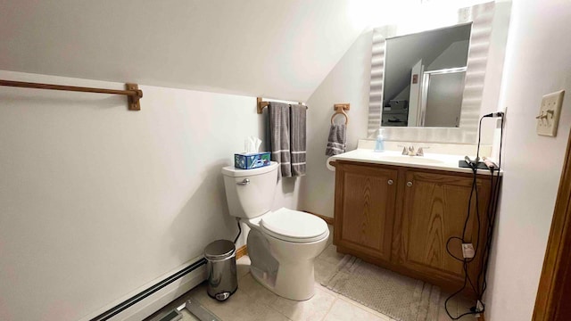 bathroom featuring a baseboard heating unit, toilet, tile flooring, and large vanity