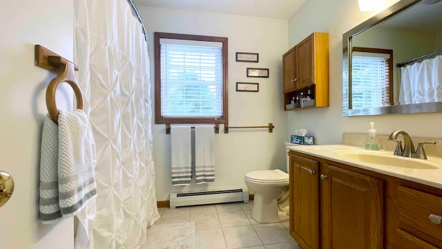 bathroom featuring a baseboard radiator, vanity, tile floors, and toilet