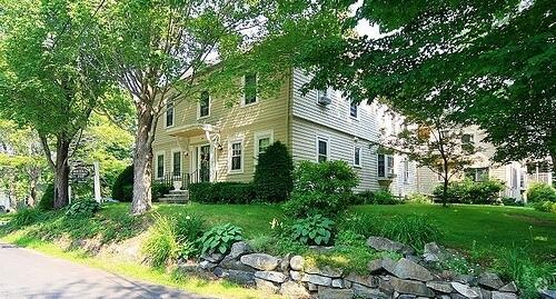 view of property exterior featuring a lawn