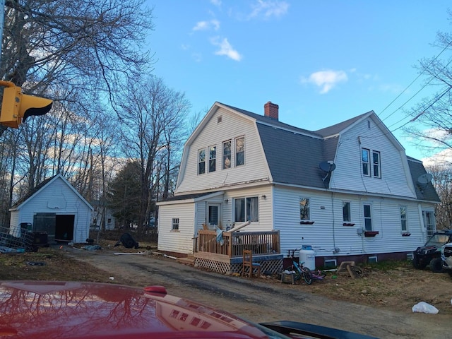 back of property with a storage unit