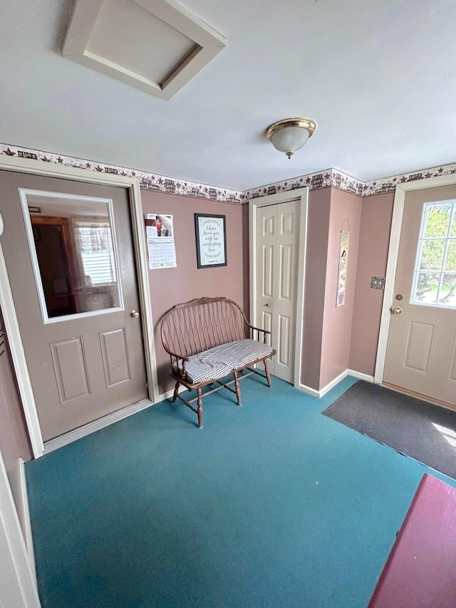 foyer featuring carpet floors