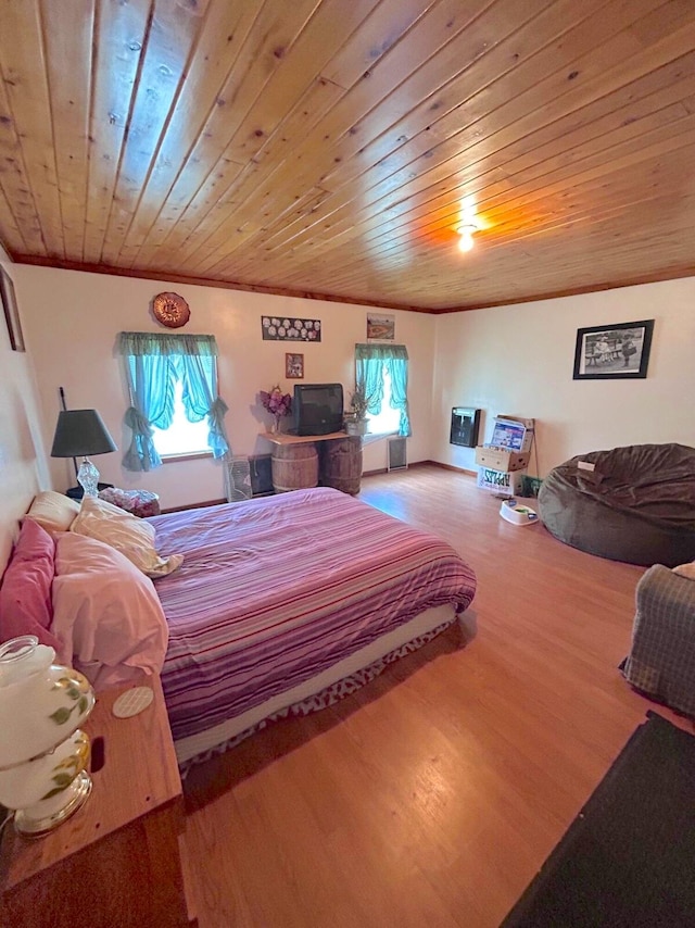 bedroom featuring hardwood / wood-style flooring and wooden ceiling