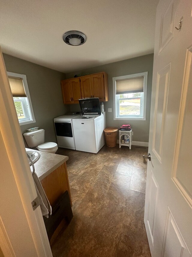 kitchen with tile flooring and independent washer and dryer