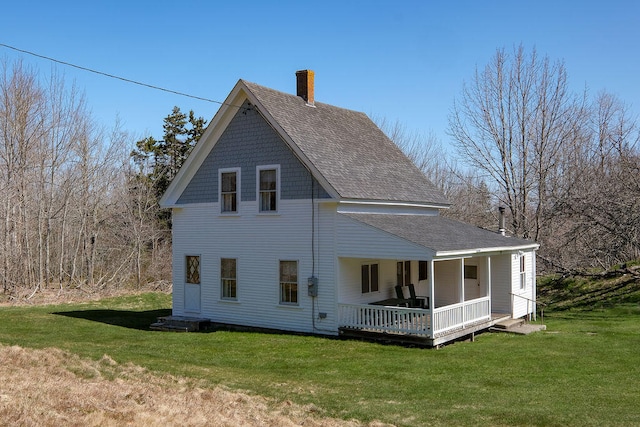 back of house with a yard