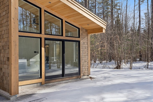 view of snow covered property entrance