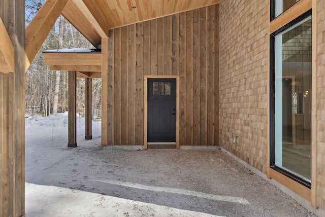 view of snow covered property entrance