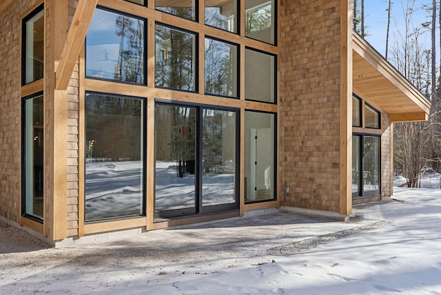 view of snow covered property entrance