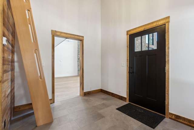 entryway with a towering ceiling