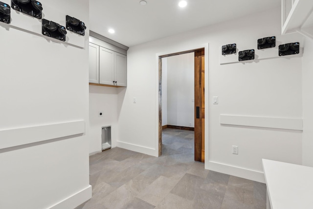 laundry area with cabinets and hookup for an electric dryer