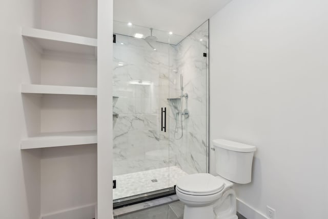 bathroom with a shower with shower door, tile patterned floors, and toilet