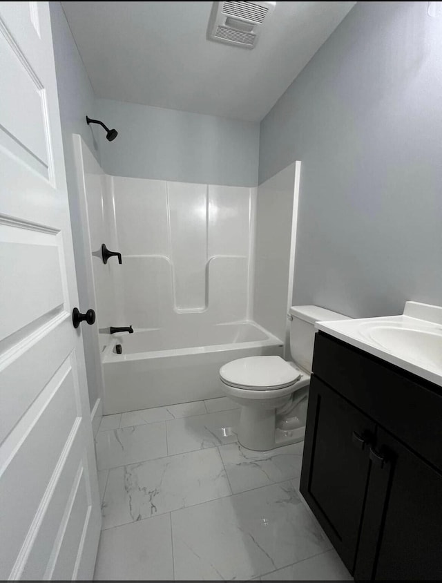 full bathroom with vanity, toilet, and washtub / shower combination