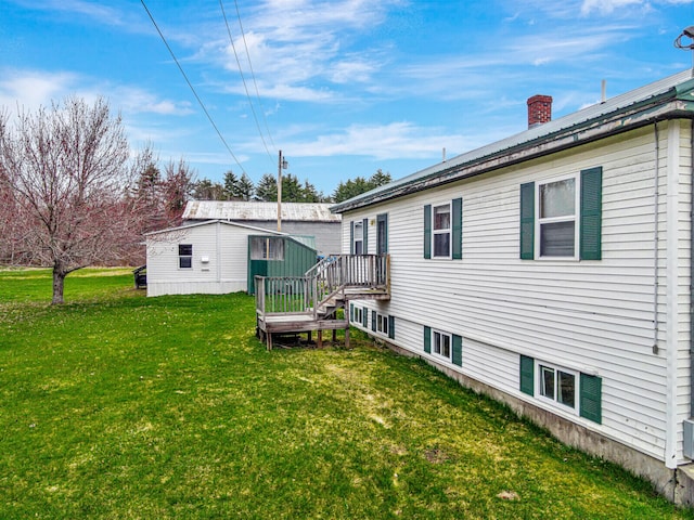 rear view of property with a lawn