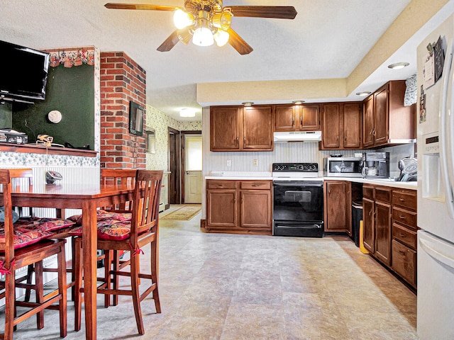 kitchen with a textured ceiling, white appliances, ceiling fan, and light tile flooring