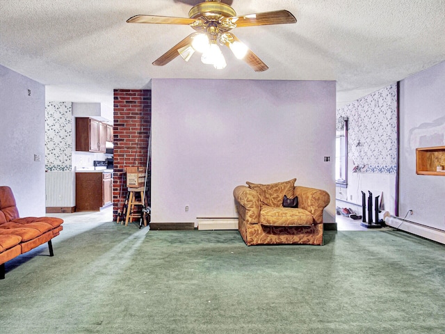 living area with brick wall, a baseboard heating unit, dark carpet, and ceiling fan