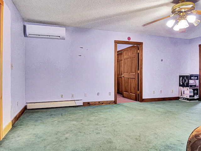 spare room featuring a wall mounted AC, a baseboard radiator, carpet floors, and ceiling fan