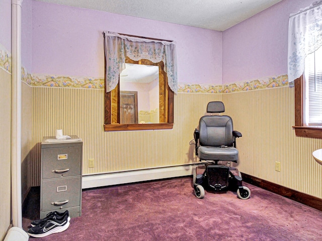 living area with a textured ceiling, dark carpet, and a baseboard radiator