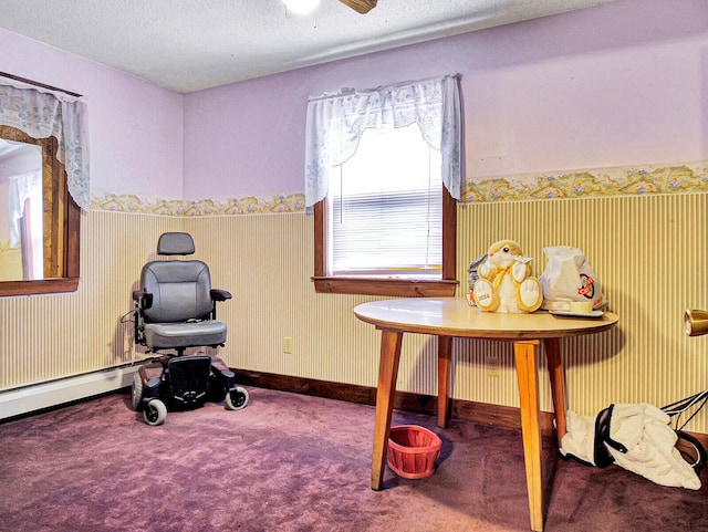 workout area with dark carpet and a textured ceiling