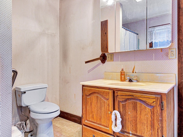 bathroom with vanity and toilet