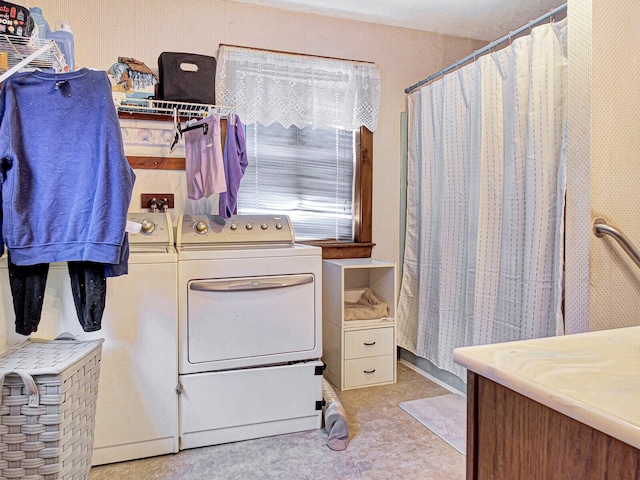 bathroom with washer and clothes dryer and vanity