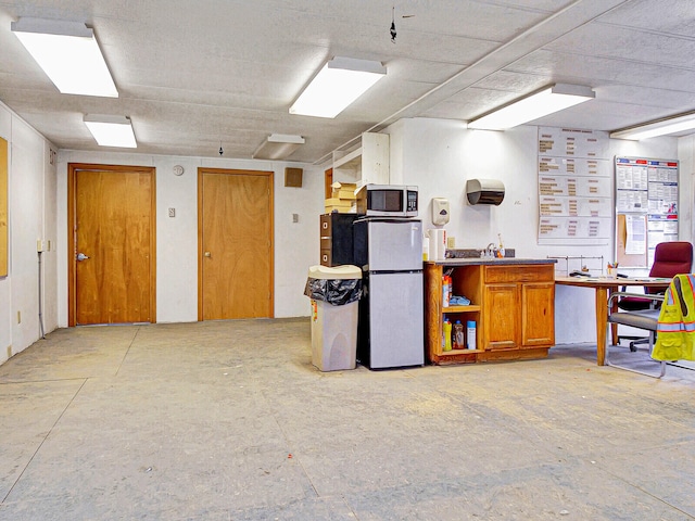 interior space featuring stainless steel fridge