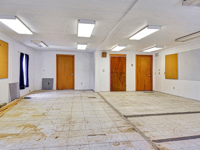 spare room featuring light tile floors