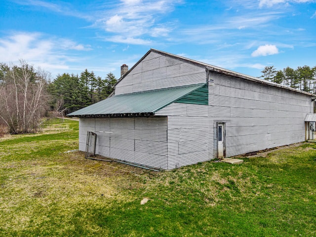 view of property exterior featuring a yard