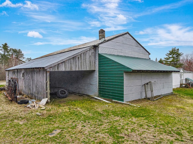 view of outdoor structure with a yard