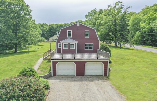 view of front of home with a garage and a front lawn