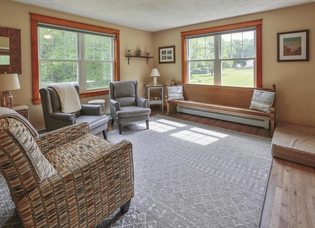 living room with light hardwood / wood-style flooring and a baseboard radiator