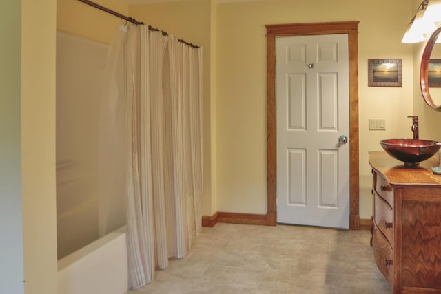 bathroom featuring shower / tub combo with curtain and vanity