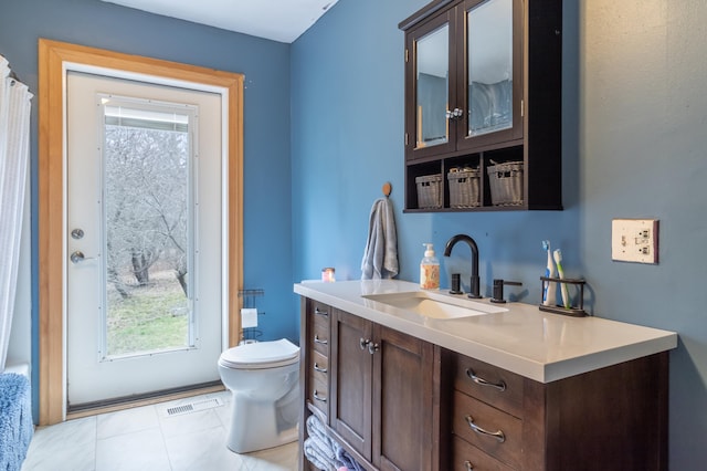 98 Old Rte 1, Gouldsboro, ME 04607 - bathroom featuring tile floors, vanity, and toilet