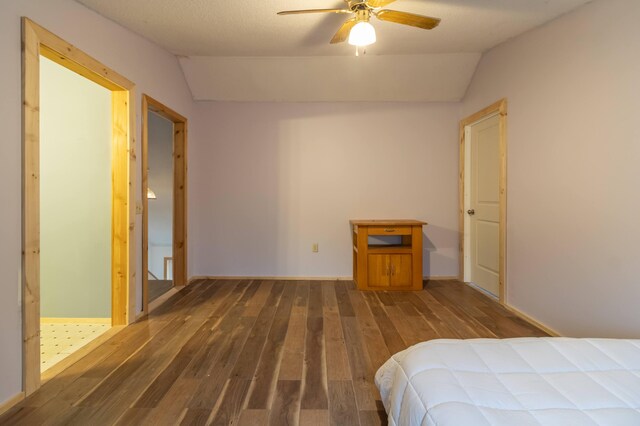 98 Old Rte 1, Gouldsboro, ME 04607 - unfurnished bedroom with ceiling fan, dark tile flooring, and vaulted ceiling
