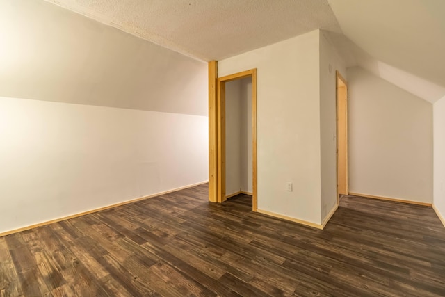98 Old Rte 1, Gouldsboro, ME 04607 - additional living space featuring dark hardwood / wood-style floors, a textured ceiling, and lofted ceiling