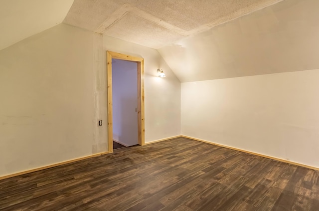 98 Old Rte 1, Gouldsboro, ME 04607 - additional living space with dark hardwood / wood-style flooring, a textured ceiling, and lofted ceiling