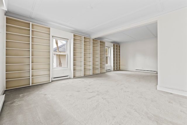 empty room featuring carpet floors and baseboard heating