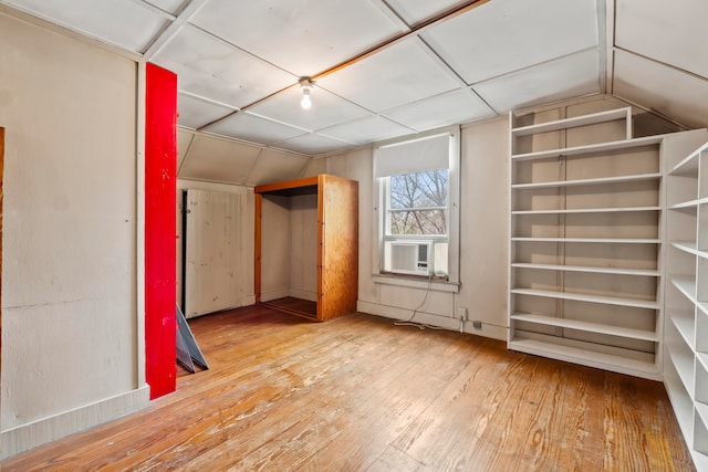 interior space featuring wood-type flooring and lofted ceiling