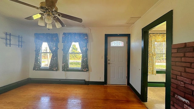 entryway with hardwood / wood-style flooring and ceiling fan