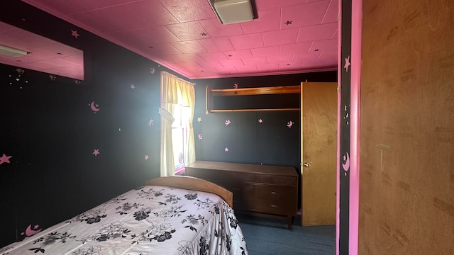 bedroom with carpet floors and ornamental molding