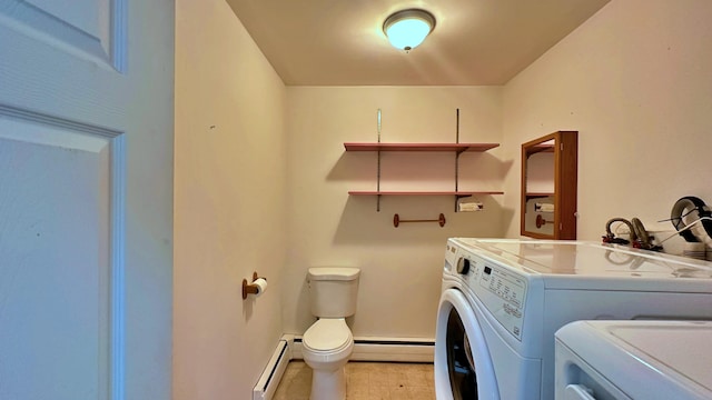 laundry area with washing machine and dryer, a baseboard heating unit, and light tile floors