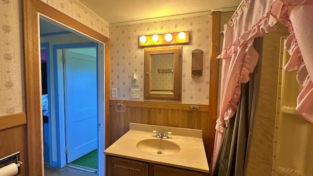 bathroom with oversized vanity and crown molding