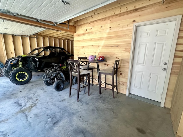 garage with wood walls